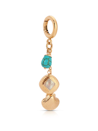 Gold charm with turquoise and shell design on a white background