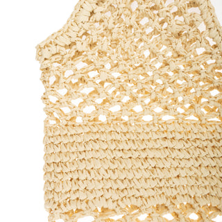 Detail shot of  a tan crochet tote bag. 