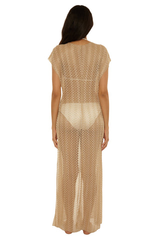 Woman wearing a beige mesh dress on a white background