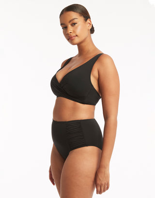 Essentials Multifit Halter Top by Sea Level in Black - Angled View